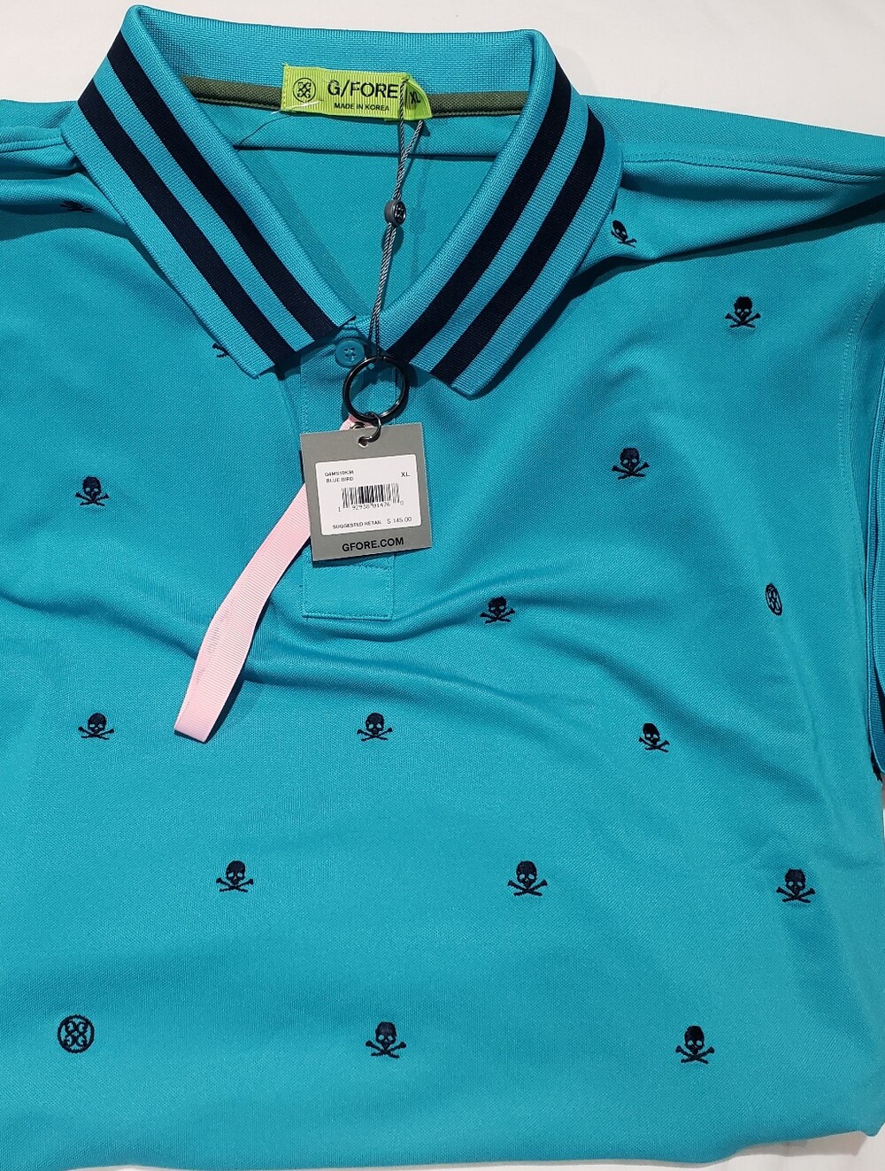 G/FORE Men’s Teal Polo with Navy Skull Embroidery